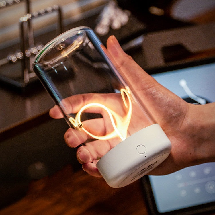 Zentrolia rechargeable LED filament night light glowing warmly on a bedside table