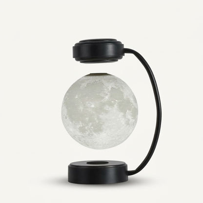 Zentrolia levitating moon lamp floating above a gold base