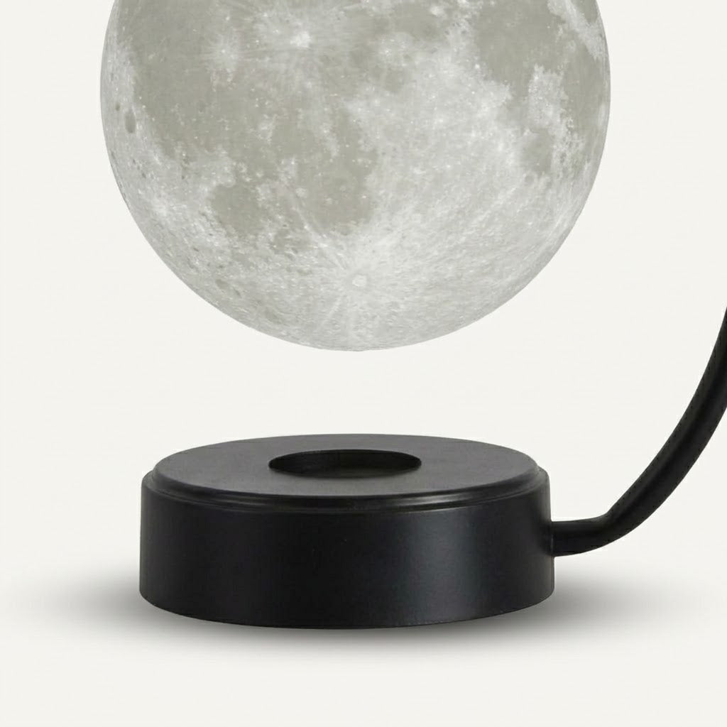 Zentrolia levitating moon lamp floating above a gold base