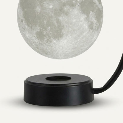 Zentrolia levitating moon lamp floating above a gold base