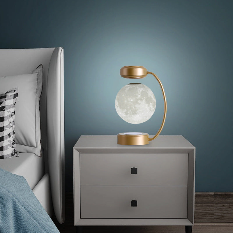 Zentrolia levitating moon lamp floating above a gold base